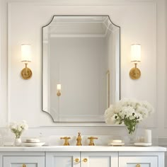 a bathroom vanity with two sinks and a large mirror