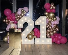 the number twenty is displayed in front of balloons