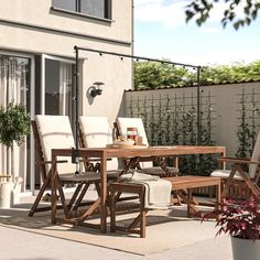 a table and chairs sitting on top of a patio