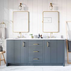 a bathroom with two sinks and mirrors on the wall