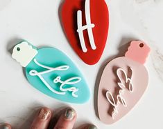 three heart shaped cookie cutters sitting on top of a white table next to each other