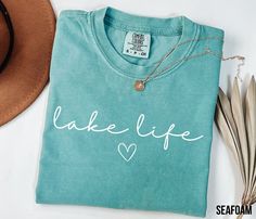 Comfort Colors Lake Life Shirt, On The Lake Tee, Travel Lover Outfit, Gift For Adventurer, Family Travel Apparel, Camper Clothing, Like Vibe HOW TO ORDER 1. Check and review all photos (including colors and sizes) 2. Select Your tshirt size and t-shirt color from drop down menu 3. Select quantity 4. Click ADD TO CART. For multiple items go back and repeat. IF THE ITEM HAS CUSTOMIZATION Make sure to specify in the customization box what you'd like. The more detail the better! GROUP LISTINGS If it Tshirt Details, Lover Outfit, Lake House Gifts, Lake Life Shirt, Travel Apparel, Travel Lover, Lake Life, Cricut Ideas, Design Color