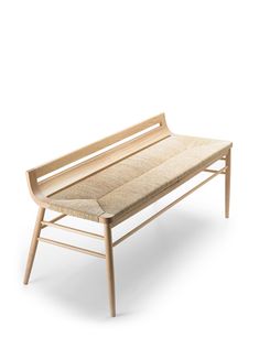 a wooden bench sitting on top of a white floor