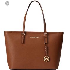 Authentic Jet Set Travel In The Color Tan. Excellent Condition. Looks Brand New! No Trades Michael Kors Travel Bag, Michael Kors Bag Brown, Designer Laptop Bag, Clear Tote Bags, Michael Kors Tote Bags, Bags Michael Kors, Brown Tote, Travel Tote Bag, Black Leather Purse