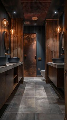 a large bathroom with two sinks and wooden cabinets on the walls, along with dark wood paneling