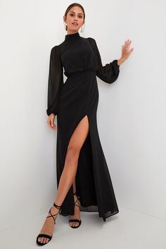 From cocktail hour to the bouquet toss, you'll be ready for it all in the Lulus Graceful Entrance Black Long Sleeve Backless Maxi Dress! Airy woven chiffon shapes this elegant gown that has long, sheer balloon sleeves with elastic at the cuffs. Bodice has blousy fit, with a mock neckline (that has two loop-button closures) and a stunning open back. High waist tops a mermaid-style maxi skirt that finishes with a sultry side slit. Hidden zipper/clasp at back. Long Sleeve Wedding Guest Dresses, Winter Wedding Guest Dress, Maxi Skirt Style, Backless Maxi Dress, Fall Wedding Guest Dress, Bouquet Toss, Black Dress Formal, Designer Evening Dresses, Cocktail Attire