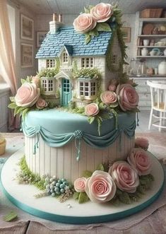 a cake with flowers on it and a house made out of fondant icing