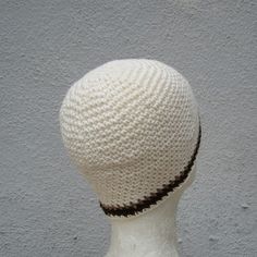 "I hand crocheted this beanie with lightweight off-white cotton/linen blend yarn and accented it with stripes of brown and beige cotton...it is made for those of you who prefer their beanies short, measuring only 7 1/2\" long and just about covering your ears- this hat will fit (or stretch to fit) most average size heads (21\"- 23\" in circumference)- please contact me if you would like a custom size. 7 1/2\"= 19.05 centimeters long 21\"-23\"= 53.34- 58.42 centimeters in circumference this beani Handmade Cotton Beanie, White Cotton Yarn Crochet Hat For Spring, Beige Cotton Yarn Hat With Crochet, Cream Knitted Beanie, White Cotton Crochet Hat Casual Style, Cream Knitted Beanie Made From Yarn, Handmade Beige Crochet Beanie, Beige Crochet Cotton Yarn Hat, Adjustable Cream Crochet Beanie