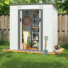 a garden shed with the doors open and gardening tools in it's storage compartment