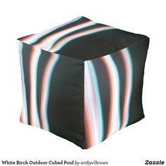 a black and white photo of a square stool cover with multicolored lines on it