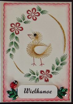 a christmas card with a bird and holly wreath