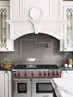 a stove top oven sitting inside of a kitchen next to a countertop with an oven