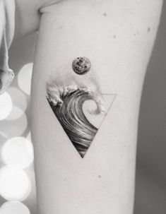 a black and white photo of a wave on the arm