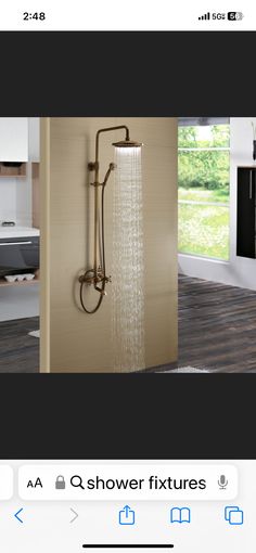 an image of a shower head in the middle of a room with wood flooring