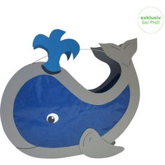 a blue and gray whale cutout with a cat on it's back sitting in front of a white background