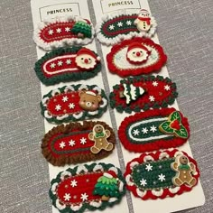 several christmas themed items are displayed on a white card board with red and green trimmings