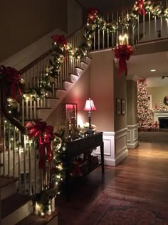 the stairs are decorated with christmas lights and garlands