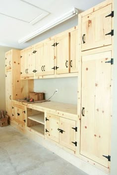 an unfinished kitchen with lots of cabinets and drawers on the wall, including cupboards