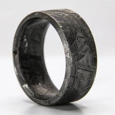 "Each meteorite ring is handcrafted out of a solid piece of meteorite in an extremely time-consuming process to create a truly unique ring that you would never find in a typical jewelry store. Due to the natural properties of meteorite, each ring will be unique with its own individual patterns. Also, it is possible for the rings to have 1 or 2 naturally occurring small voids or pockets in them; these do not affect the strength or natural beauty of each ring. ■ Ring Details: - Metal Type: Muonion Meteorite Ring Men, Mens Wedding Bands Unique, Fantasy Ring, Mens Rings Fashion, Meteorite Ring, Mens Engagement, Ring Men, Engagement Rings For Men, Mens Accessories Fashion