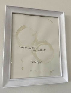 a white frame hanging on the wall with a poem written in cursive writing