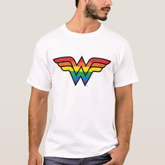 a man wearing a white t - shirt with the wonder woman symbol on it's chest