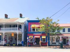 colorful buildings line the street in front of each other