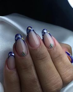 Are you looking for colored French tip nails to put a modern twist on a classic manicure? If so, you’ll love these 40 unique designs for your next nail set, just like this dark blue manicure with glitter. Colored French Tips, Chic Manicure, Blue French Tips, Colorful French