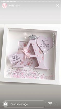 a birthday card in a white box with pink flowers