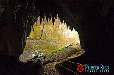 the inside of a cave with stairs leading up to it