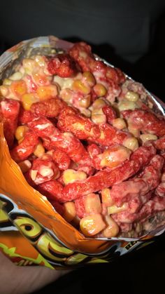 a bag filled with lots of candy sitting on top of a table