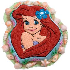 the little mermaid cake is decorated with fondant