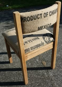 a wooden chair sitting on top of a sidewalk