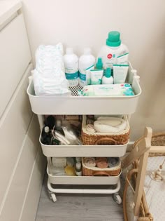 an organized bathroom cabinet with toiletries and personal care items in the bottom drawer area