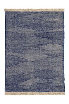 a blue rug with fringes on it