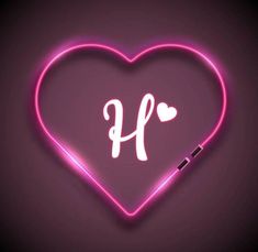 a neon heart with the letter h on it