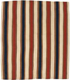 a red, white and blue striped rug on a white background with horizontal stripes in the middle