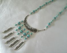 "Turquoise Necklace This beautiful necklace has turquoise beads, silver plated accent beads, pewter silver bead caps, pewter silver feather pendant and pewter silver feather drops. 16\" long adjustable to 20\" long. Silver plated lobster clasp." Southwestern Turquoise Necklace For Western-themed Events, Southwestern Style Silver Turquoise Necklace For Western-themed Events, Southwestern Adjustable Turquoise Necklace Hand-strung, Bohemian Cowgirl, Adjustable Southwestern Turquoise Necklace Hand-strung, Western Necklace, Cowgirl Wedding, Western Necklaces, Southwestern One-of-a-kind Turquoise Necklace