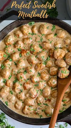 a skillet filled with meatballs covered in gravy and garnished with parsley