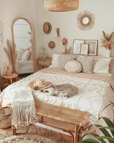 a bed room with a neatly made bed and lots of mirrors on the wall above it