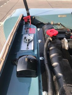 the engine compartment of a boat with an electronic device attached to it's side