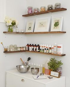 two shelves with various items on them in the same room