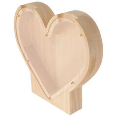 a wooden heart shaped object on a white background