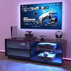 the entertainment center is lit up with blue lights and features an interactive gaming console for video games