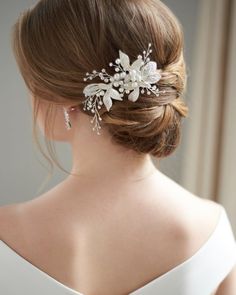 a woman wearing a bridal hair comb