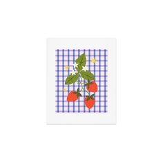 three strawberries on a blue and white checkered tablecloth