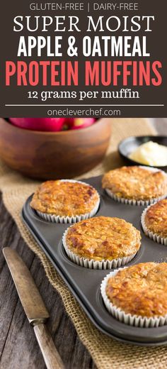 some muffins sitting on top of a pan with an apple in the background