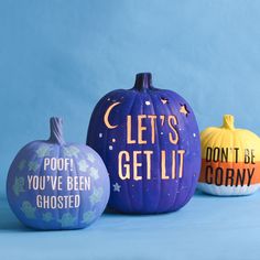 three painted pumpkins that say let's get lit