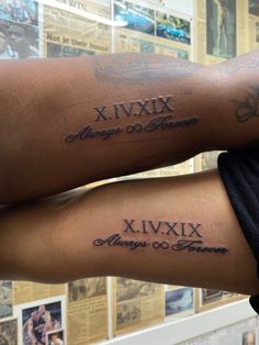 two people with tattoos on their arms and legs, both have roman numerals