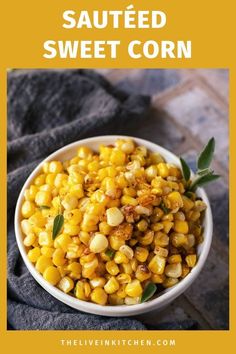 a white bowl filled with corn on top of a table