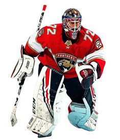 an ice hockey goalie in red and white uniform